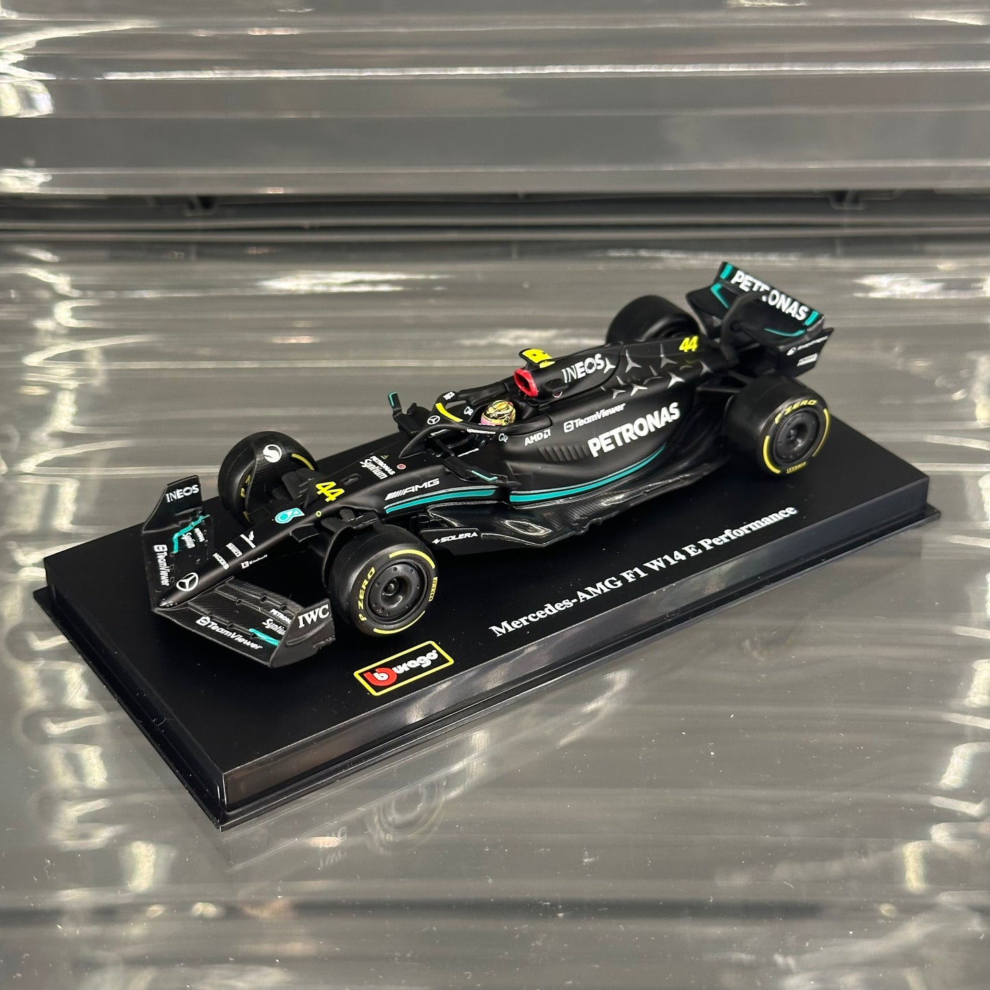 Bburago Mercedes-AMG Petronas W14 Performance (2023) with Driver's Helmet & Showcase 1:43