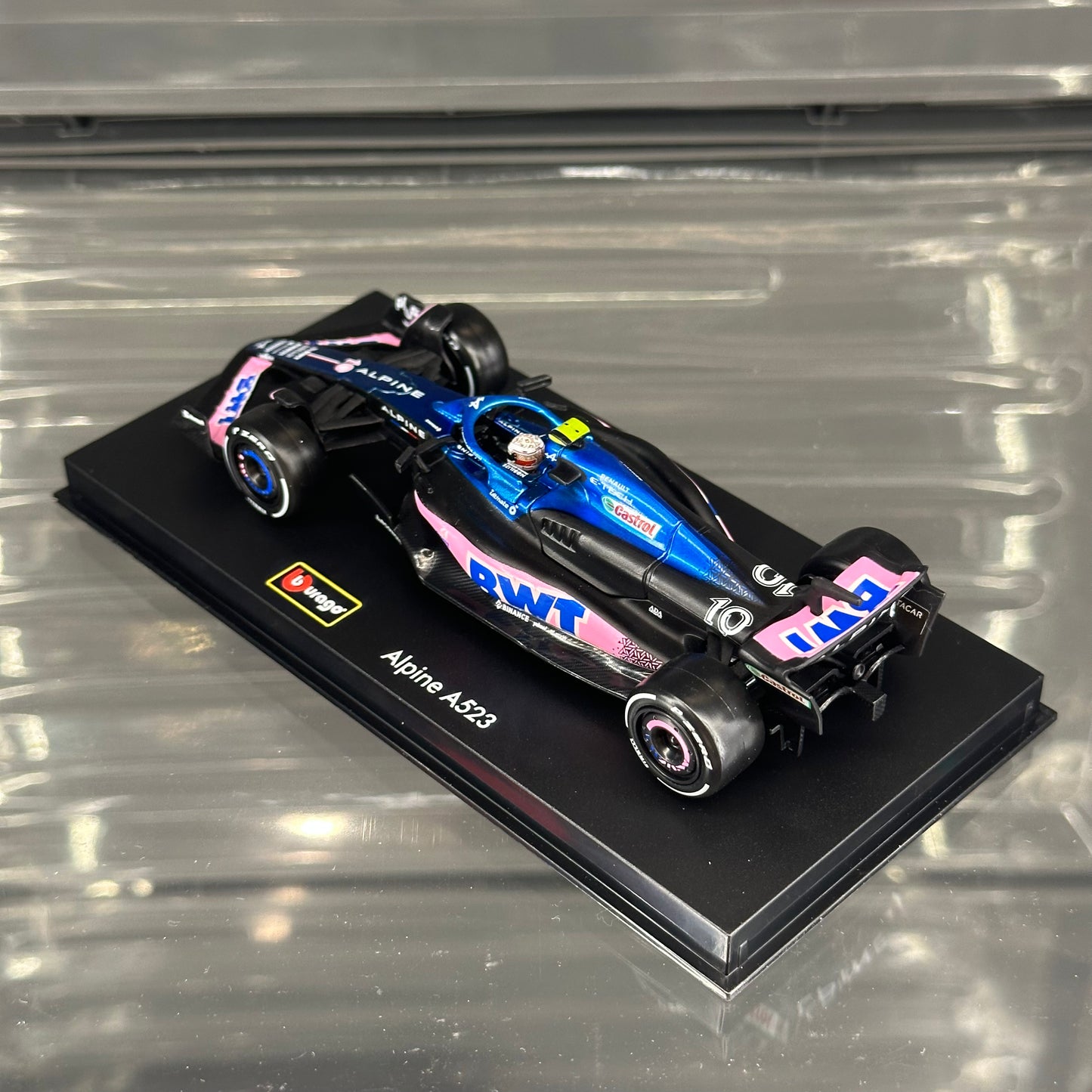 Bburago BWT Alpine F1 A523 (2023) Blue Livery with Driver's Helmet & Showcase 1:43
