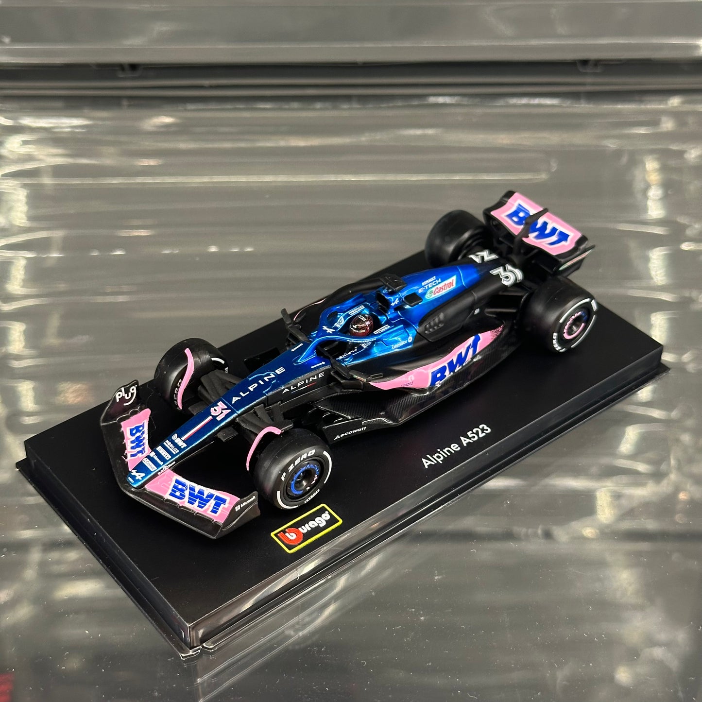 Bburago BWT Alpine F1 A523 (2023) Blue Livery with Driver's Helmet & Showcase 1:43
