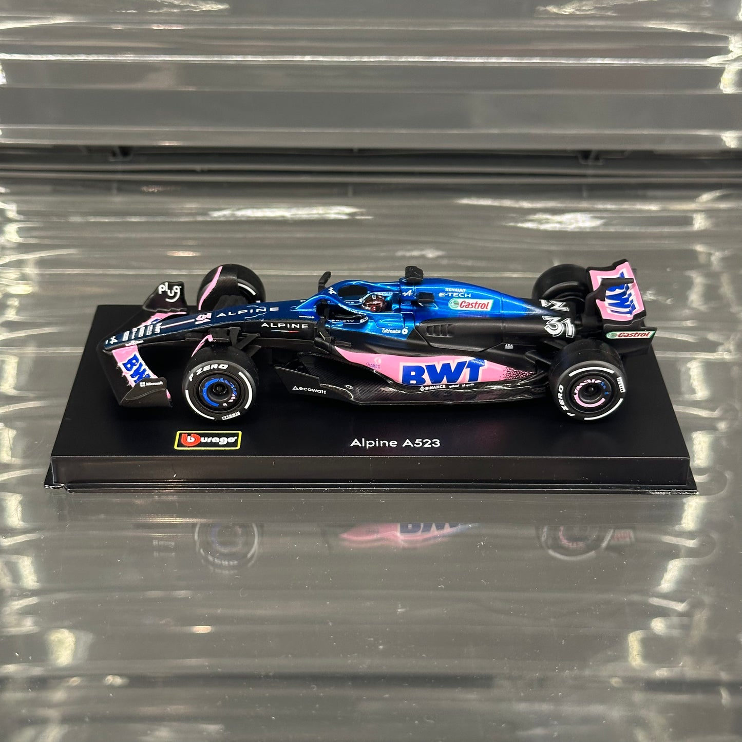 Bburago BWT Alpine F1 A523 (2023) Blue Livery with Driver's Helmet & Showcase 1:43