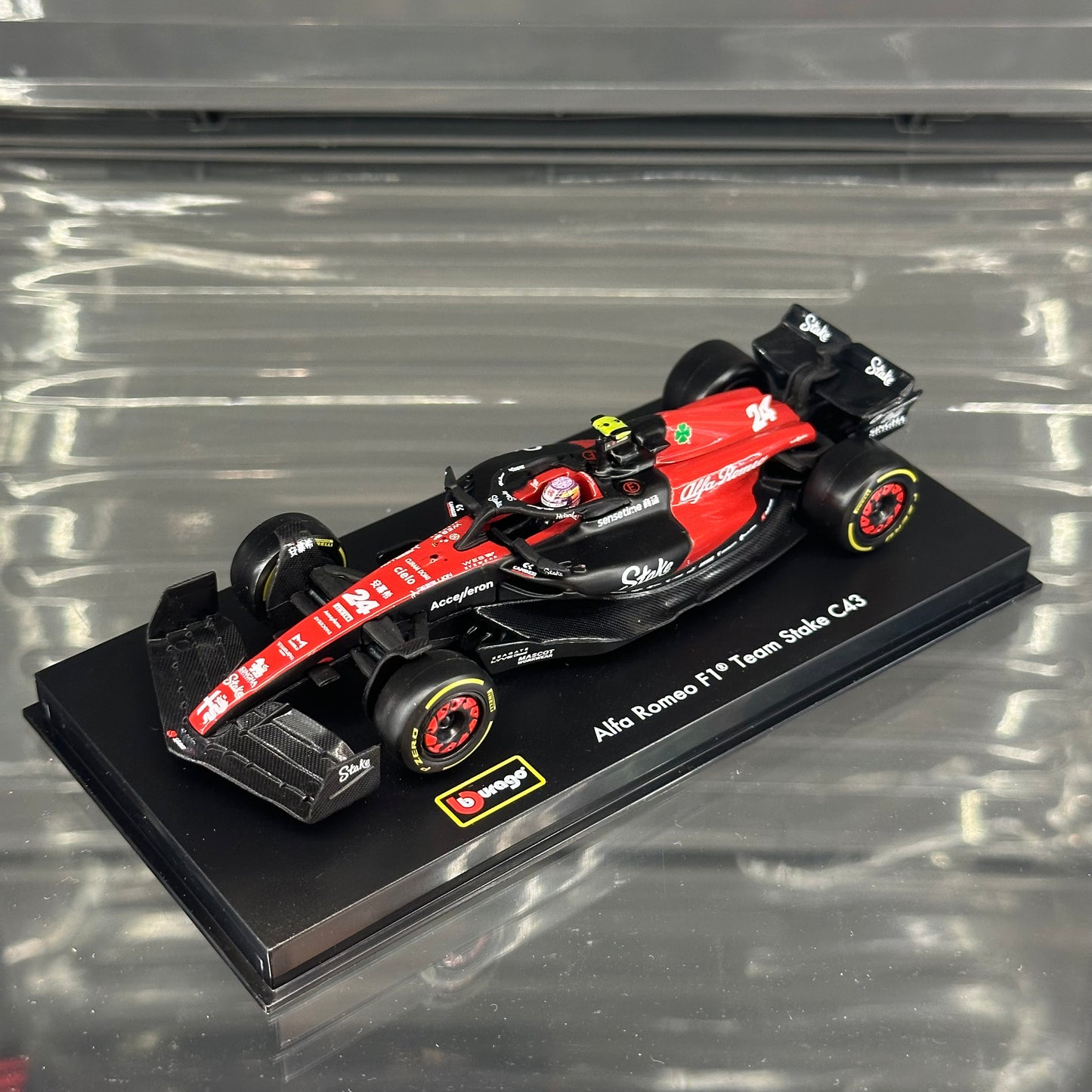 Bburago Alfa Romeo Stake F1 C43 (2023) with Driver's Helmet & Showcase 1:43