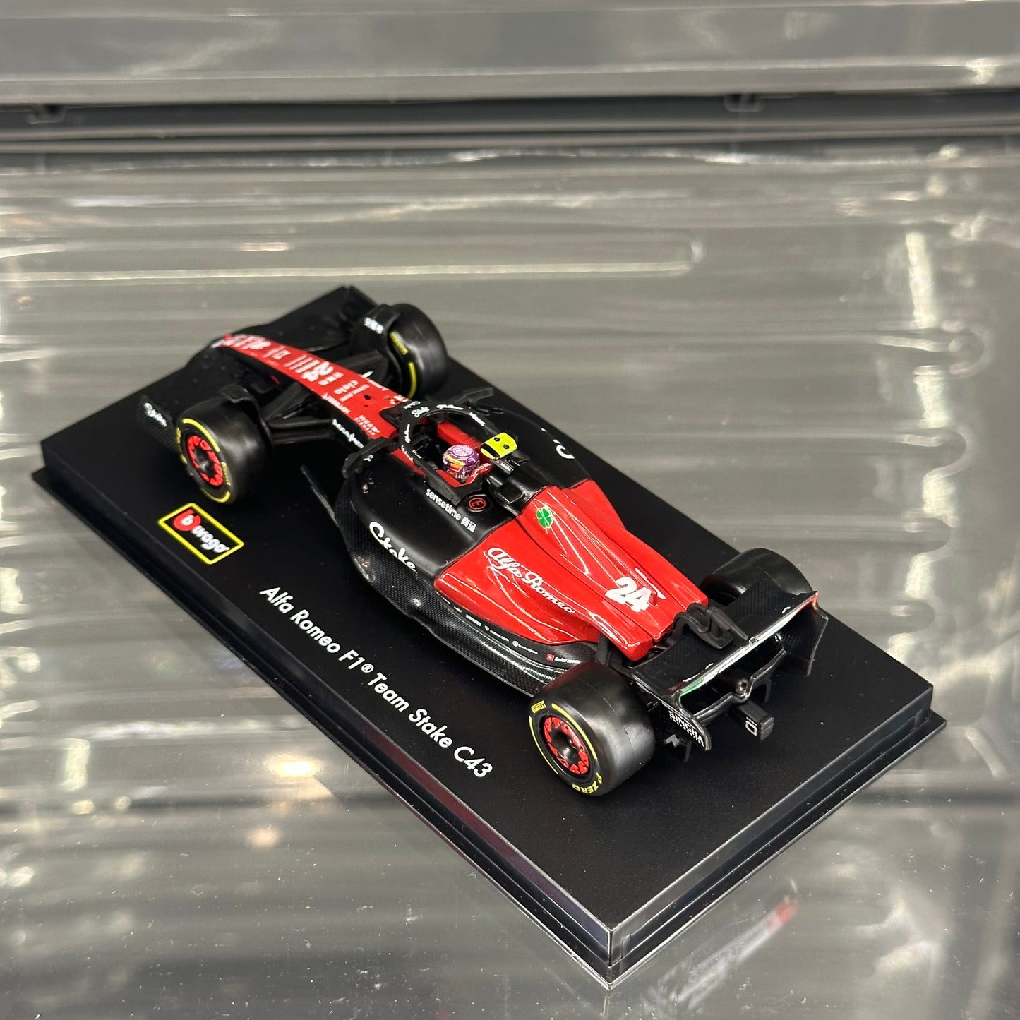 Bburago Alfa Romeo Stake F1 C43 (2023) with Driver's Helmet & Showcase 1:43