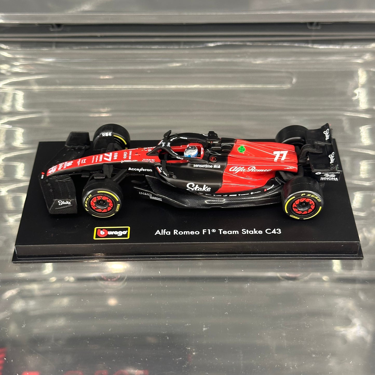 Bburago Alfa Romeo Stake F1 C43 (2023) with Driver's Helmet & Showcase 1:43