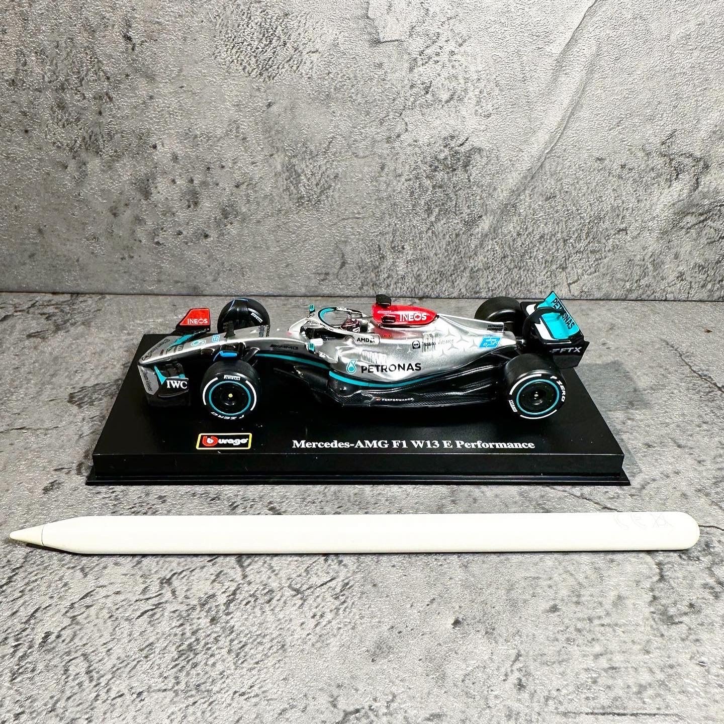 Mercedes-AMG W13E Performance (2022) 1:43 with Driver’s Helmet & Showcase
