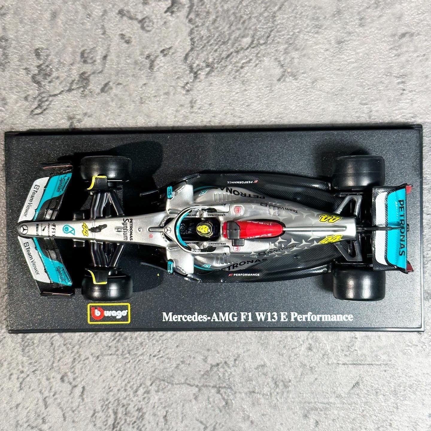 Mercedes-AMG W13E Performance (2022) 1:43 with Driver’s Helmet & Showcase