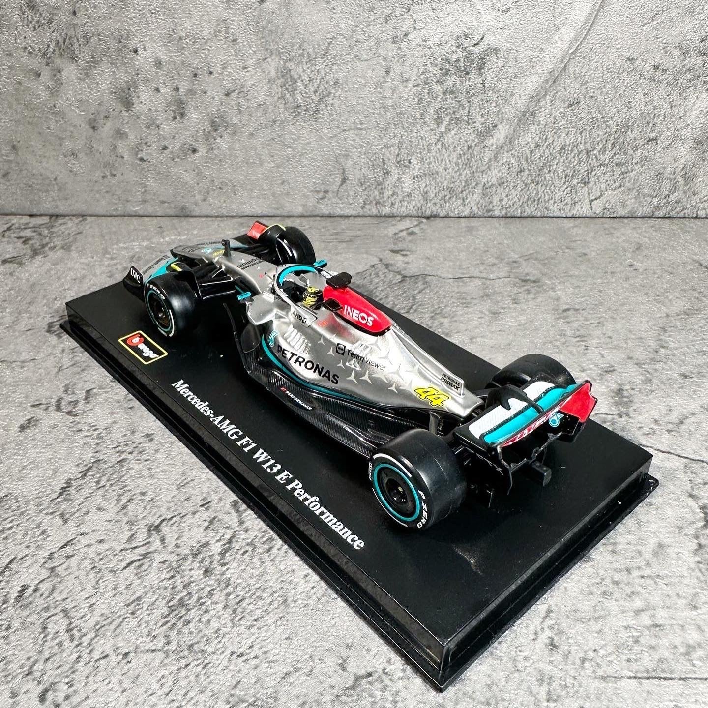 Mercedes-AMG W13E Performance (2022) 1:43 with Driver’s Helmet & Showcase