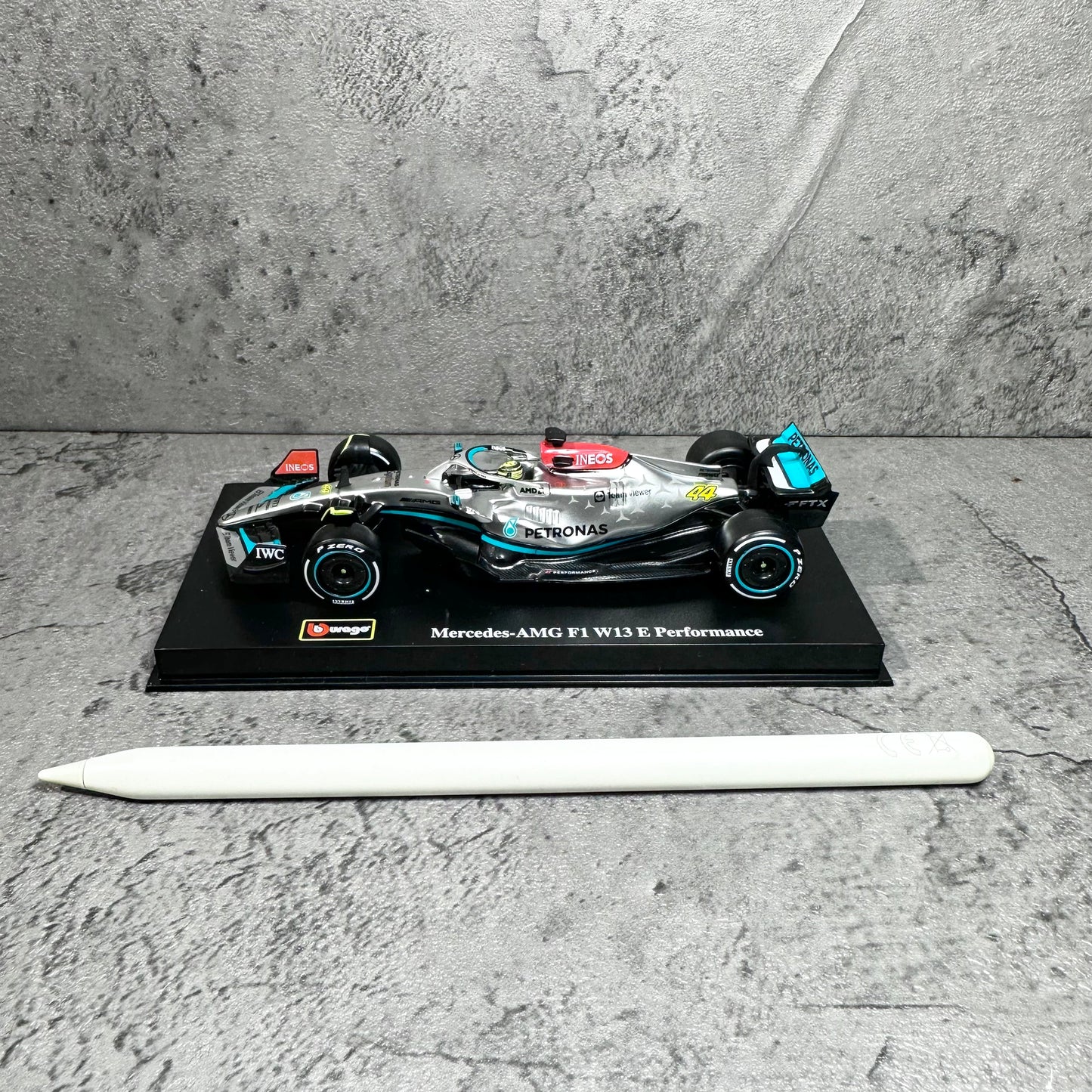Mercedes-AMG W13E Performance (2022) 1:43 with Driver’s Helmet & Showcase