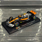 Bburago McLaren F1 MCL60 British GP Special Livery (2023) with Driver's Helmet & Showcase 1:43