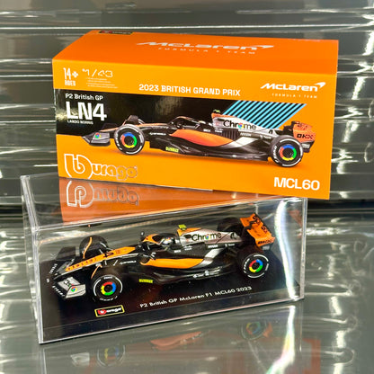 Bburago McLaren F1 MCL60 British GP Special Livery (2023) with Driver's Helmet & Showcase 1:43