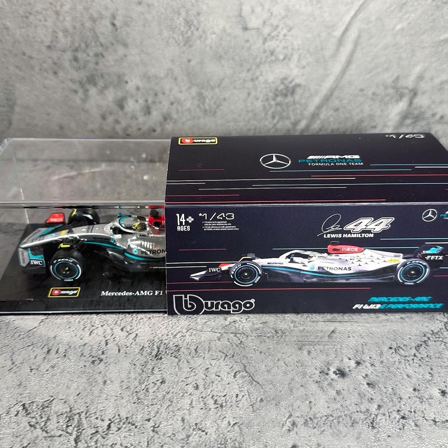 Mercedes-AMG W13E Performance (2022) 1:43 with Driver’s Helmet & Showcase